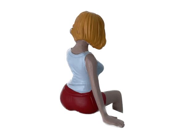Frau sitzend